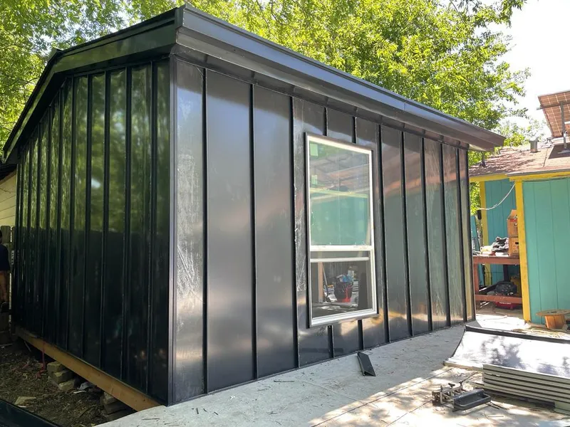 Black standing seam metal wall panels for Roof Inspection in Baldwin City