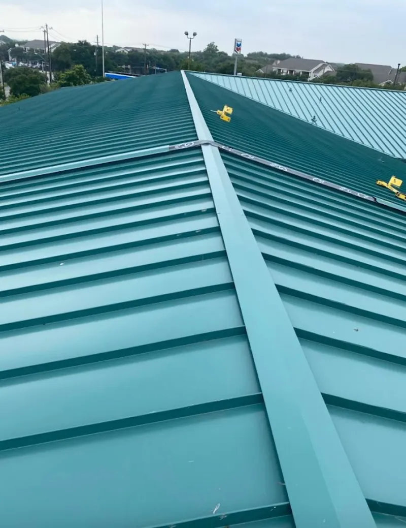 Green commercial metal roof ridge and valley for Metal Roof Repair in Baldwin City