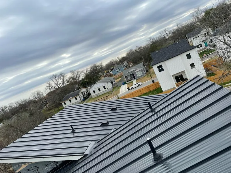 Standing seam metal roof panels with vents for Skylight Repair in Baldwin City